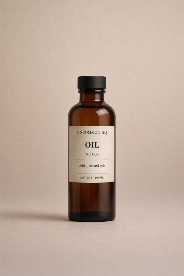 Studio photo of Uncommon HQ cold-pressed oil bottle packaging
